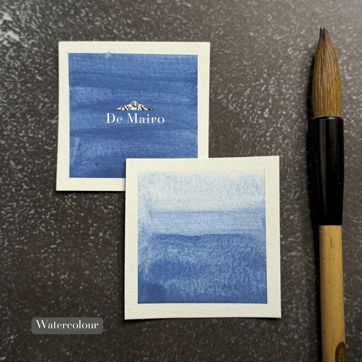 Lapis Lazuli Ultramarine Ash Pigment watercolour swatches beside a clean paintbrush