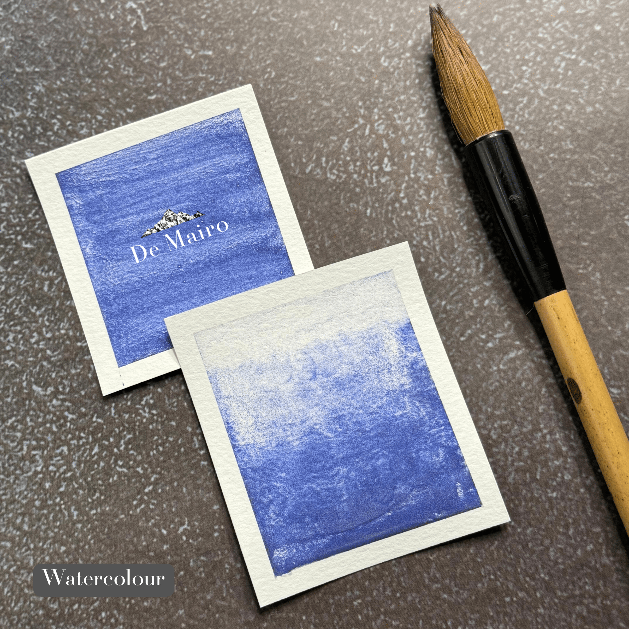 Genuine Lapis Lazuli Indigo Shade Pigment watercolour swatches besides a paintbrush