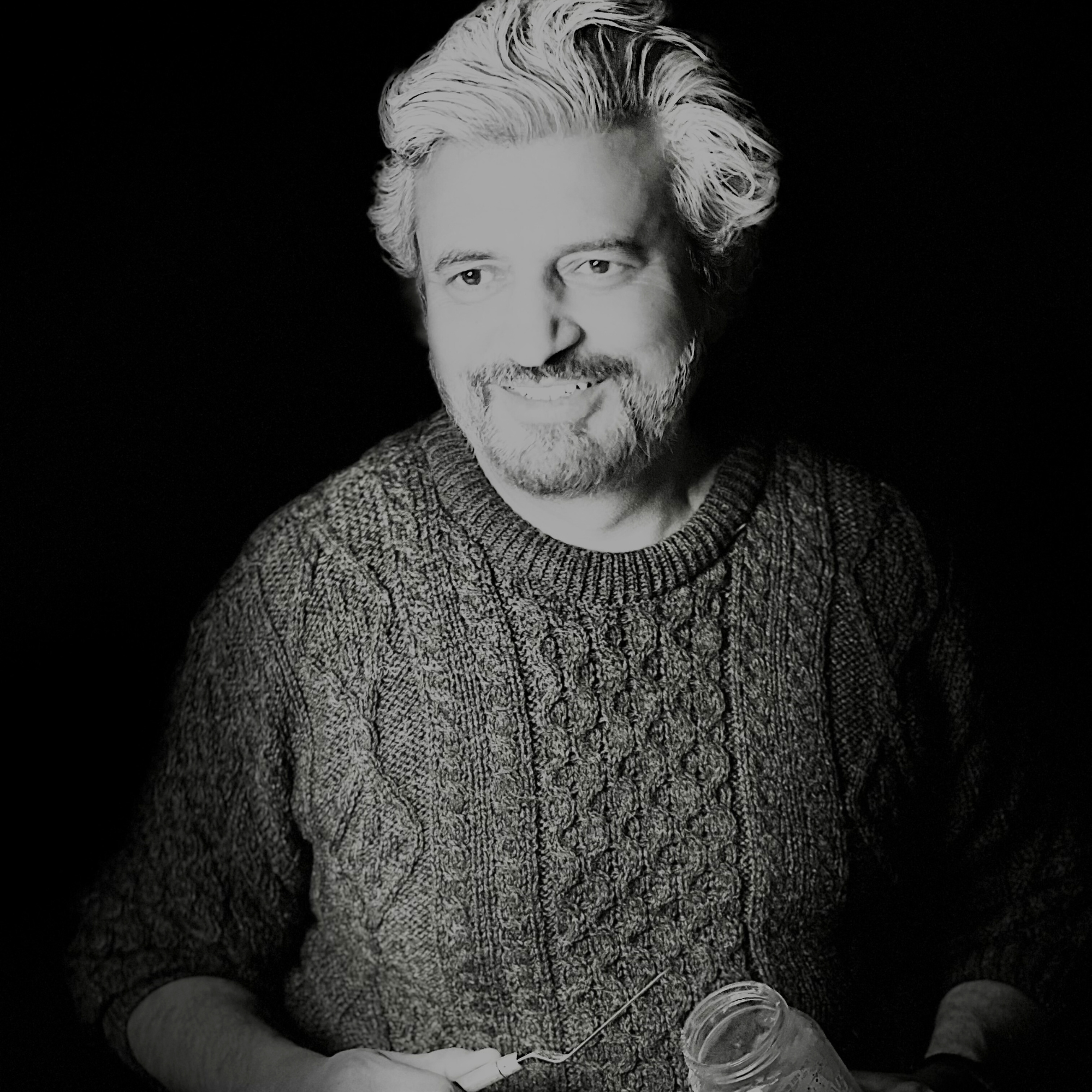 Muhammad Irfan Smiling in a black and white portrait picture 