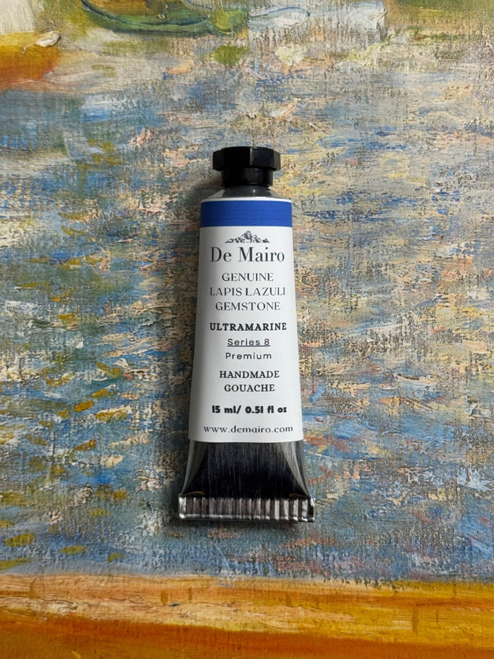 De Mairo gouache paint tube on a textured painting background