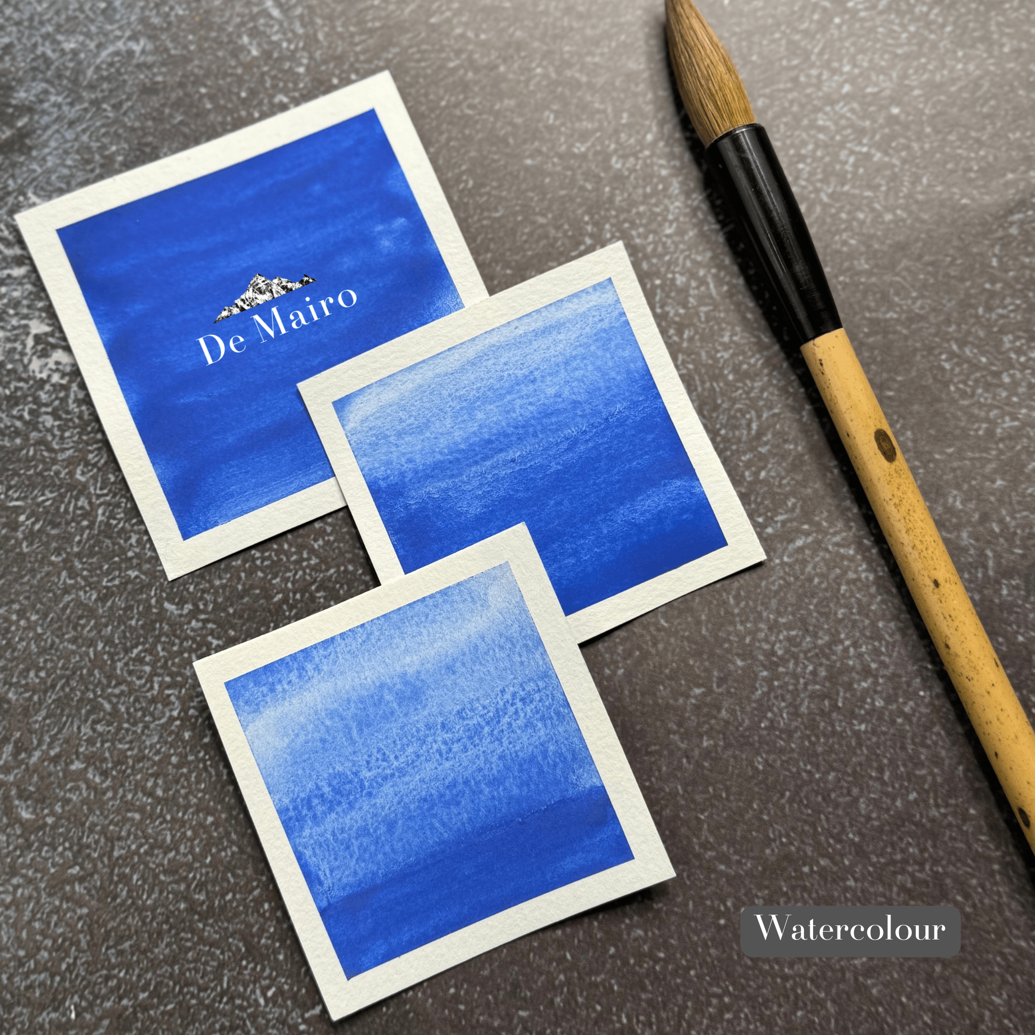 Fra Angelico lapis lazuli watercolour painted on swatch cards beside a brush