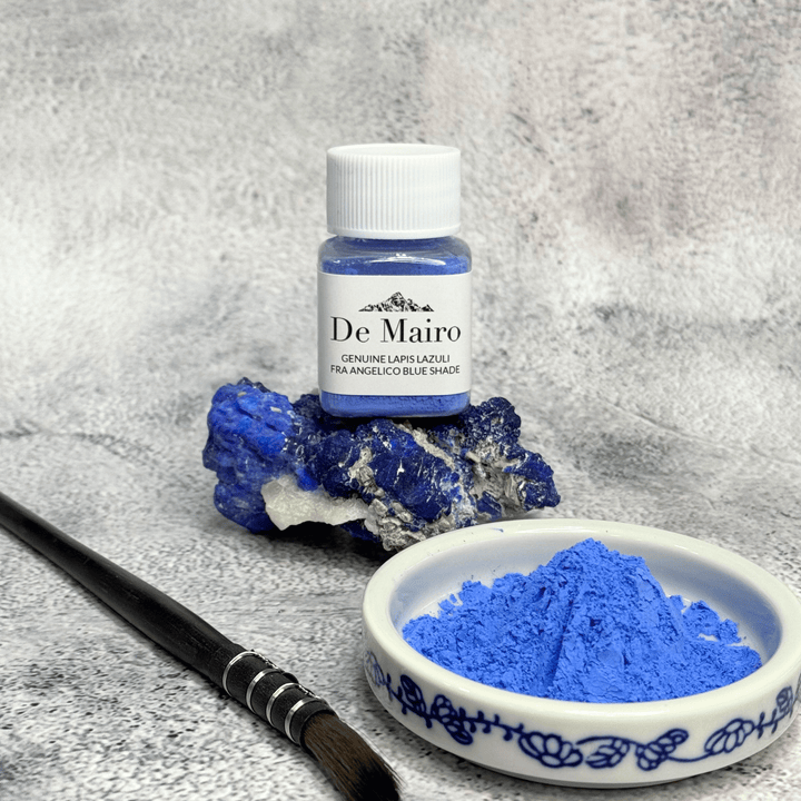 De Mairo Fra Angelico natural ultramarine pigment in a jar beside a painted dish of blue powder and a brush