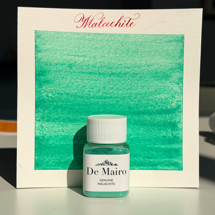 Genuine malachite green pigment swatch with the De Mairo malachite bottle
