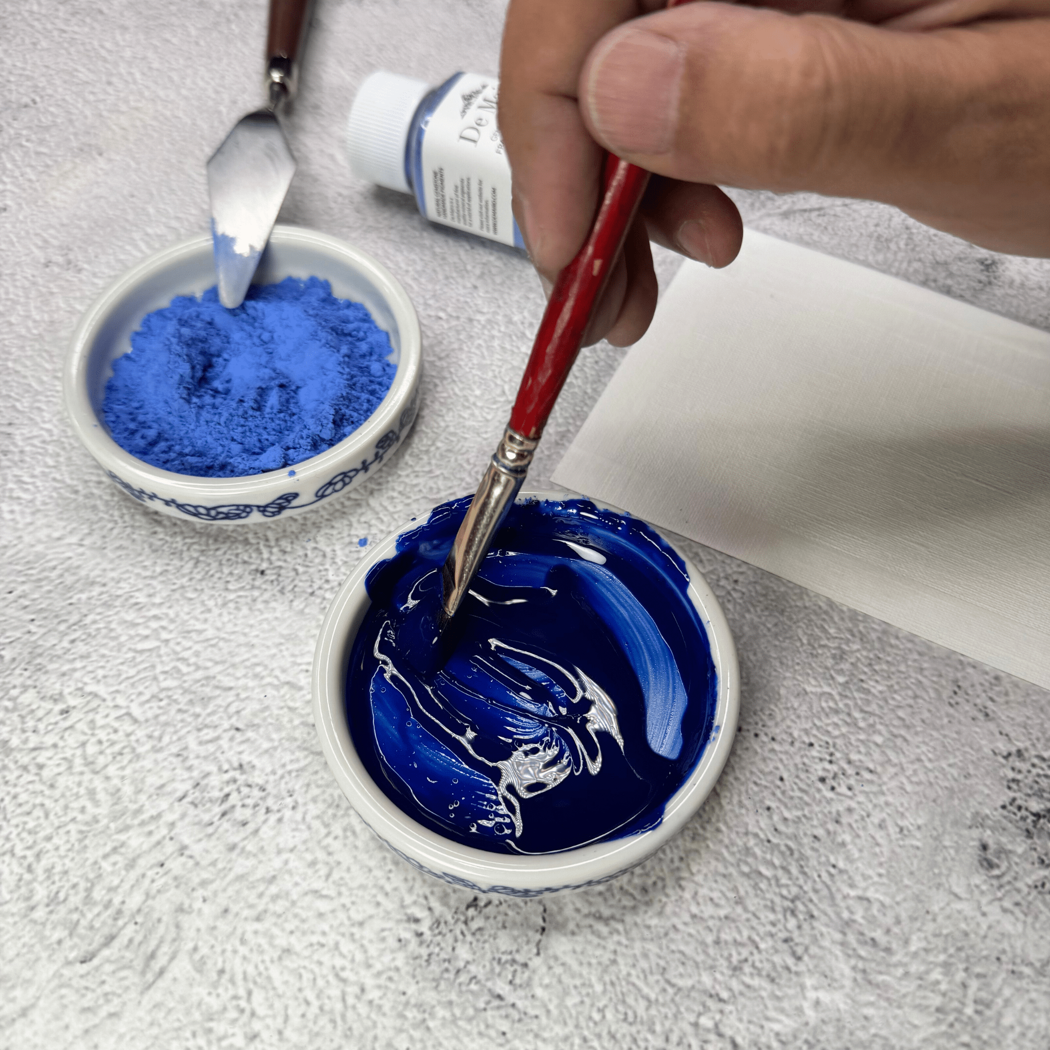 Mixing Fra Angelico lapis lazuli pigment with binder by hand to make paint